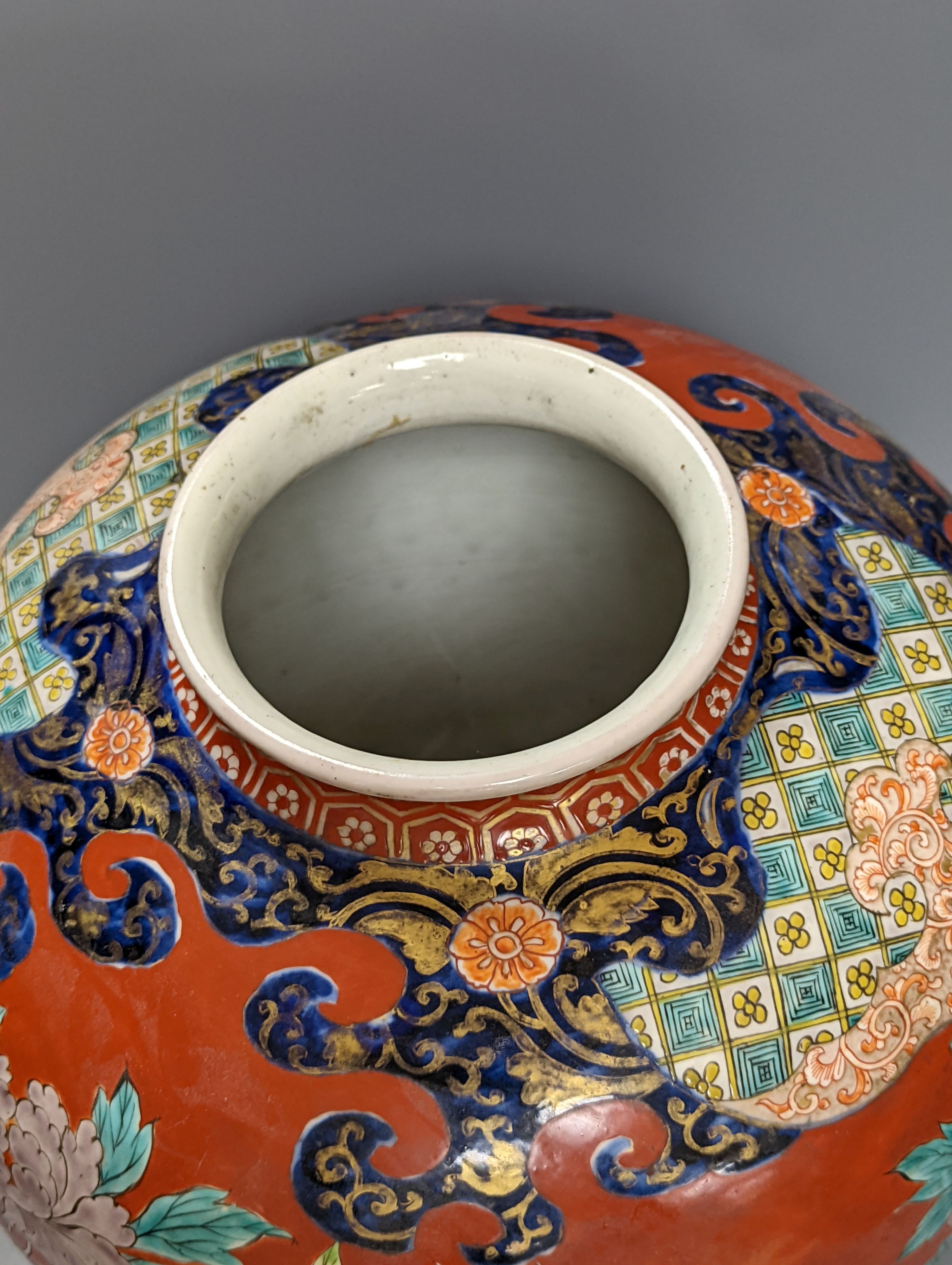A large Japanese Kutani ovoid vase, painted with Buddhist Lions 36cm